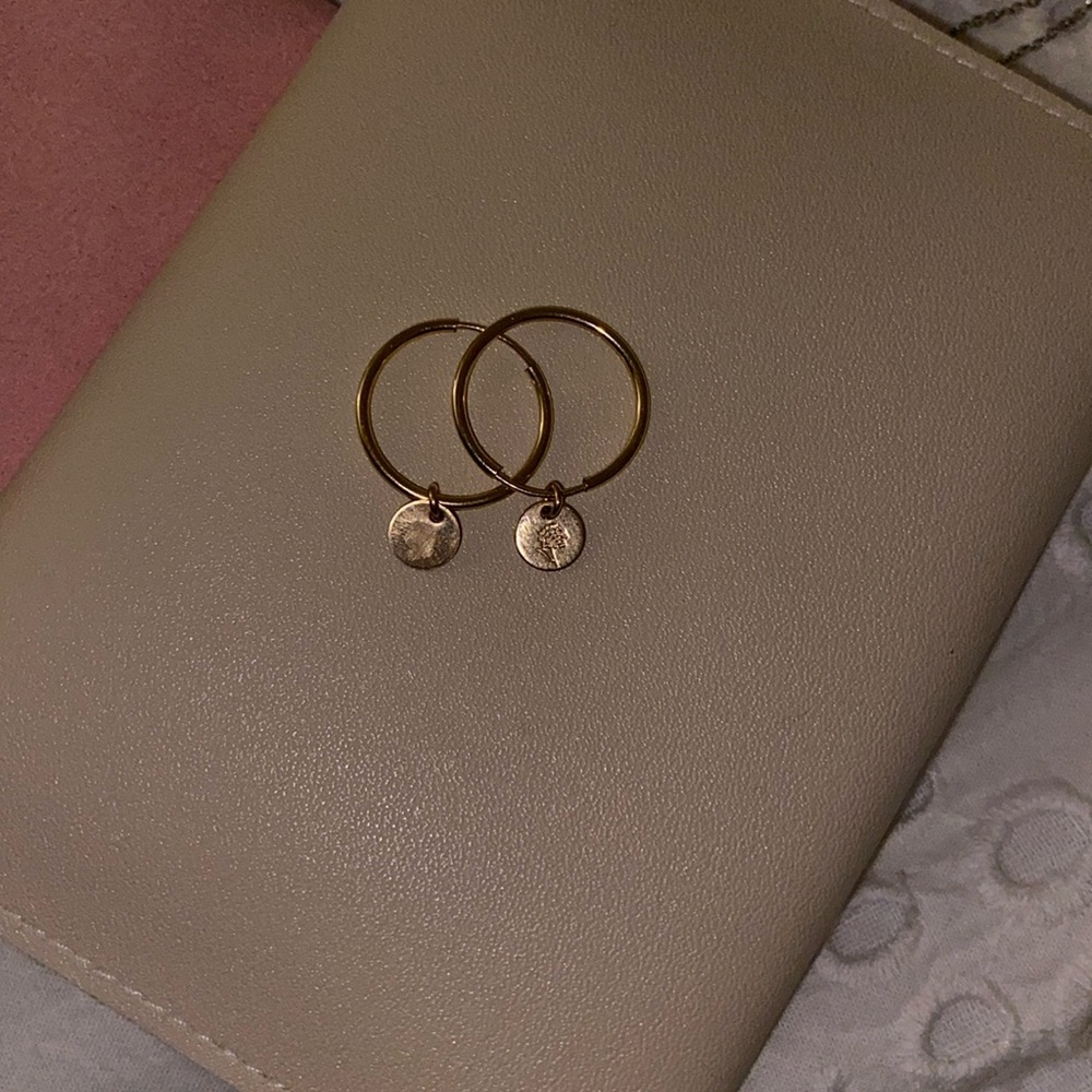 Gold hoop earrings with flowers